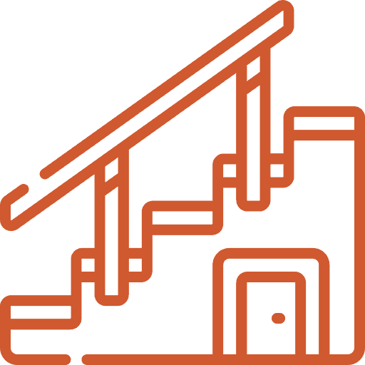 Construction stairs with safety railing at a building site.